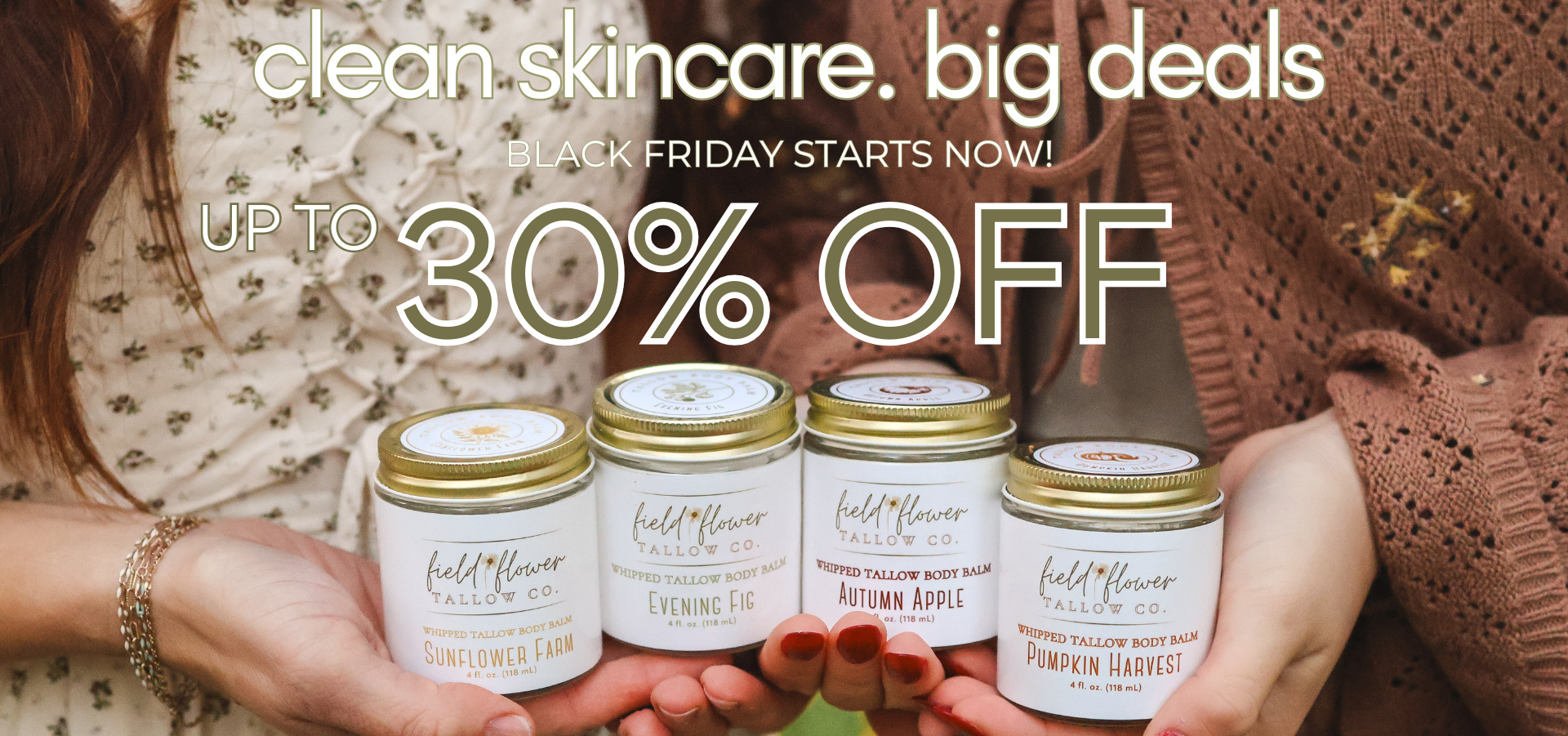 Hand holding skincare jars with promotional text for clean skincare deals on a blurred background